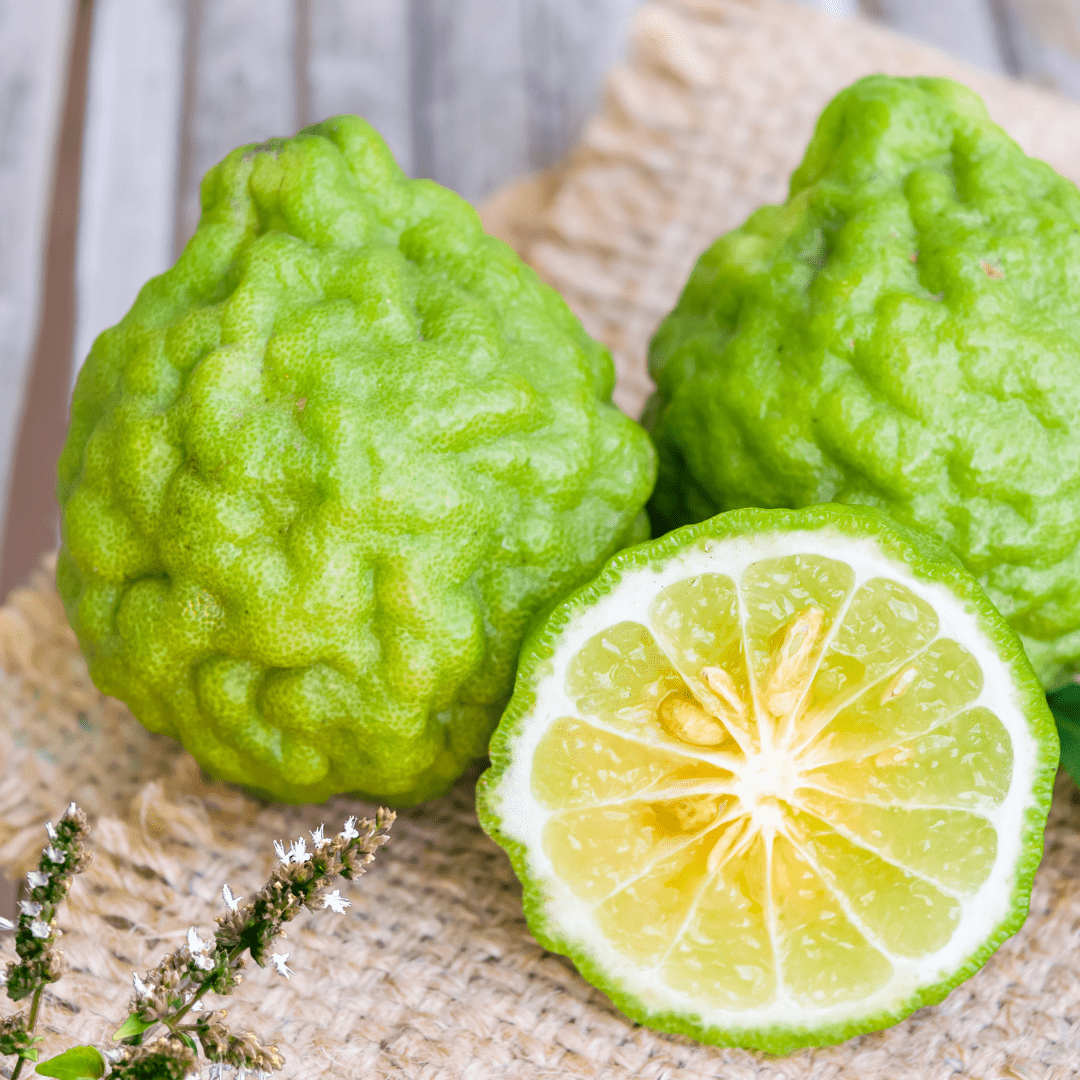 bergamot fruit resting on hessian runner with patchouli floral