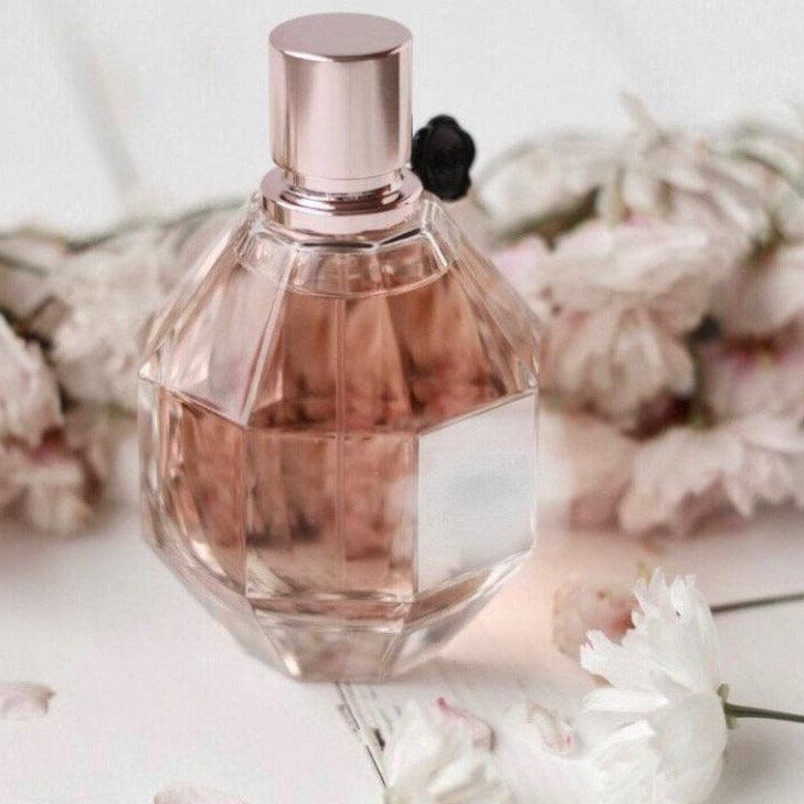 octagon perfume bottle with pink lquid and rose gold lid