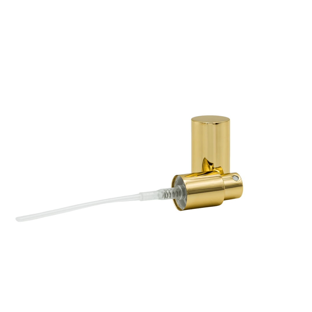 gold mister spray lying on side with matching cap