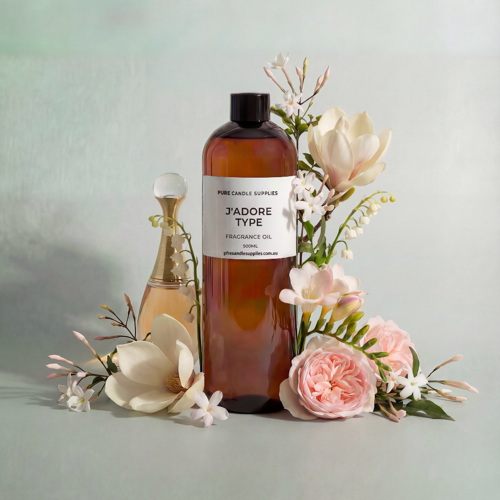 Bottle of 'J'adore Type' fragrance oil with flowers on a light background