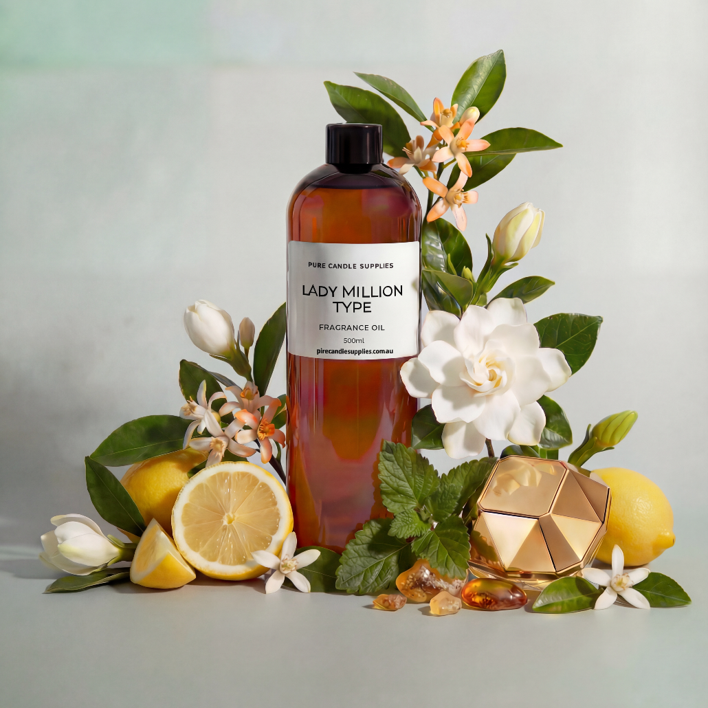 Bottle of Lady Million Type fragrance oil surrounded by flowers and lemons on a light background
