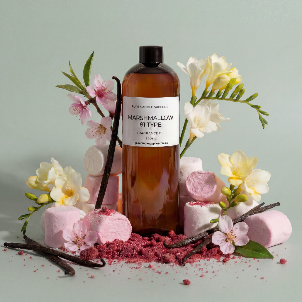 Bottle of Marshmallow B Type fragrance oil with vanilla beans and flowers on a light green background