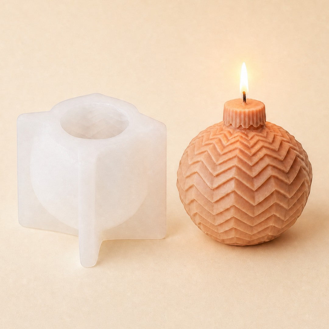 Pure Candle Supplies Melbourne chevron Christmas bauble silicone mould next to a finished peach-coloured candle