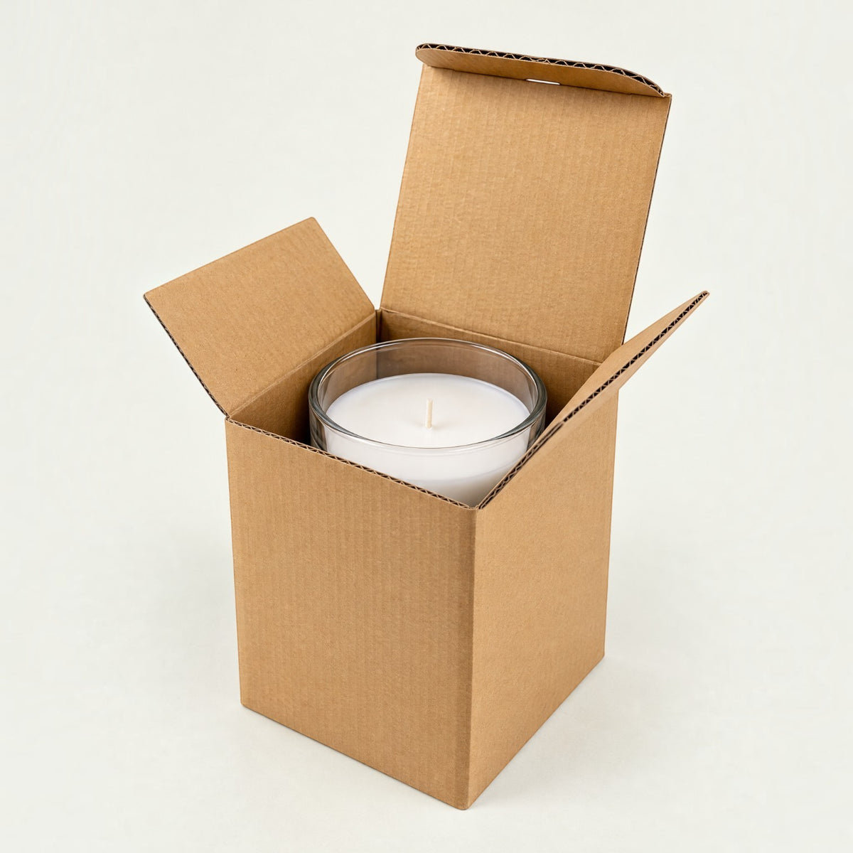 Pure Candle Supplies Melbourne medium kraft corrugated cardboard mailer box with a glass candle jar inside