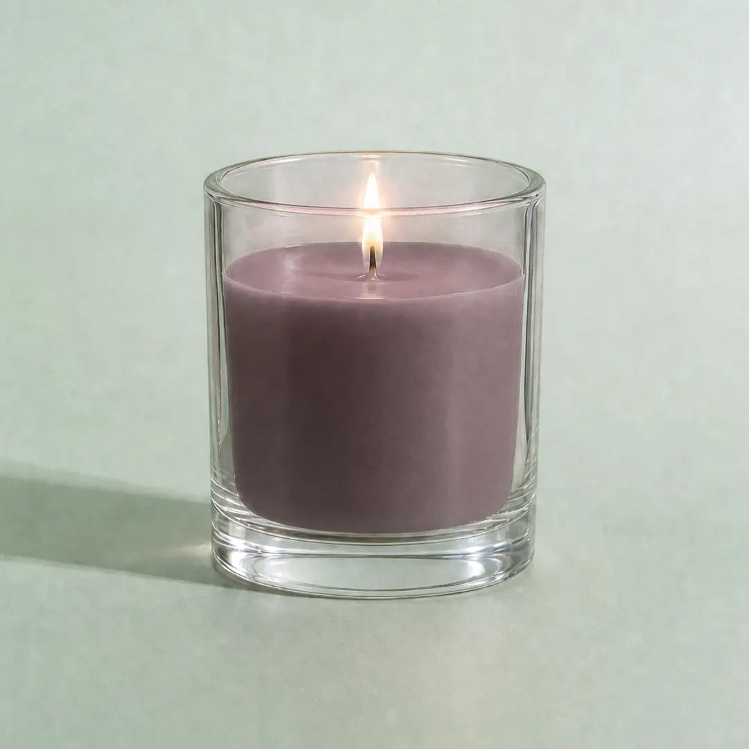 Pure Candle Supplies Melbourne Palo Santo dye chip coloured wax in a clear glass container with a lit candle wick