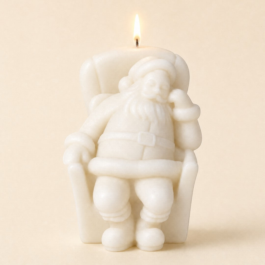 Pure Candle Supplies Melbourne Sleepy Santa candle made from white soy wax, featuring a resting Santa in a chair.