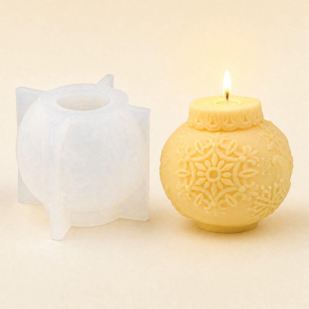 Pure Candle Supplies Melbourne snowflake Christmas bauble silicone mould next to a finished cream-coloured candle