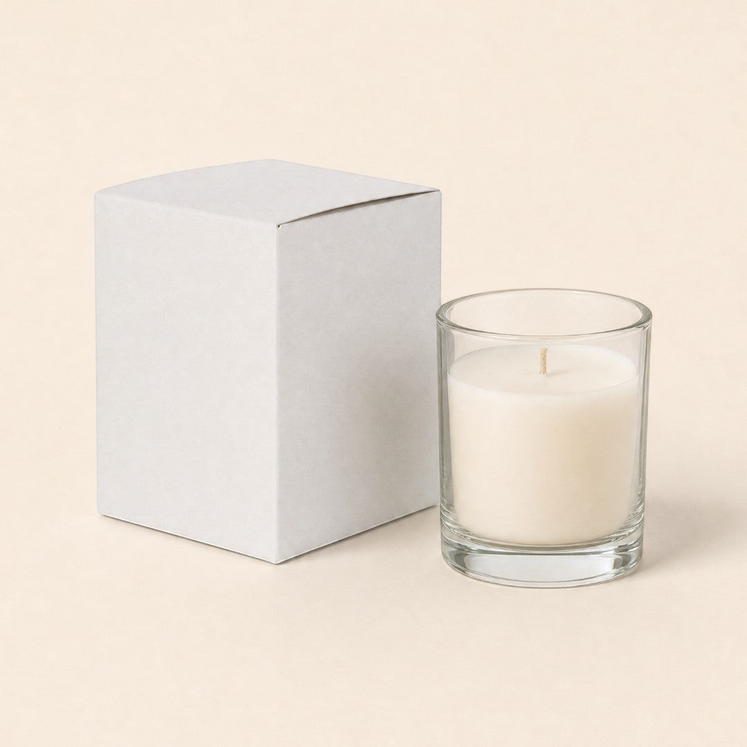 Pure Candle Supplies Melbourne white candle jar packaging box next to a clear glass candle on a neutral background
