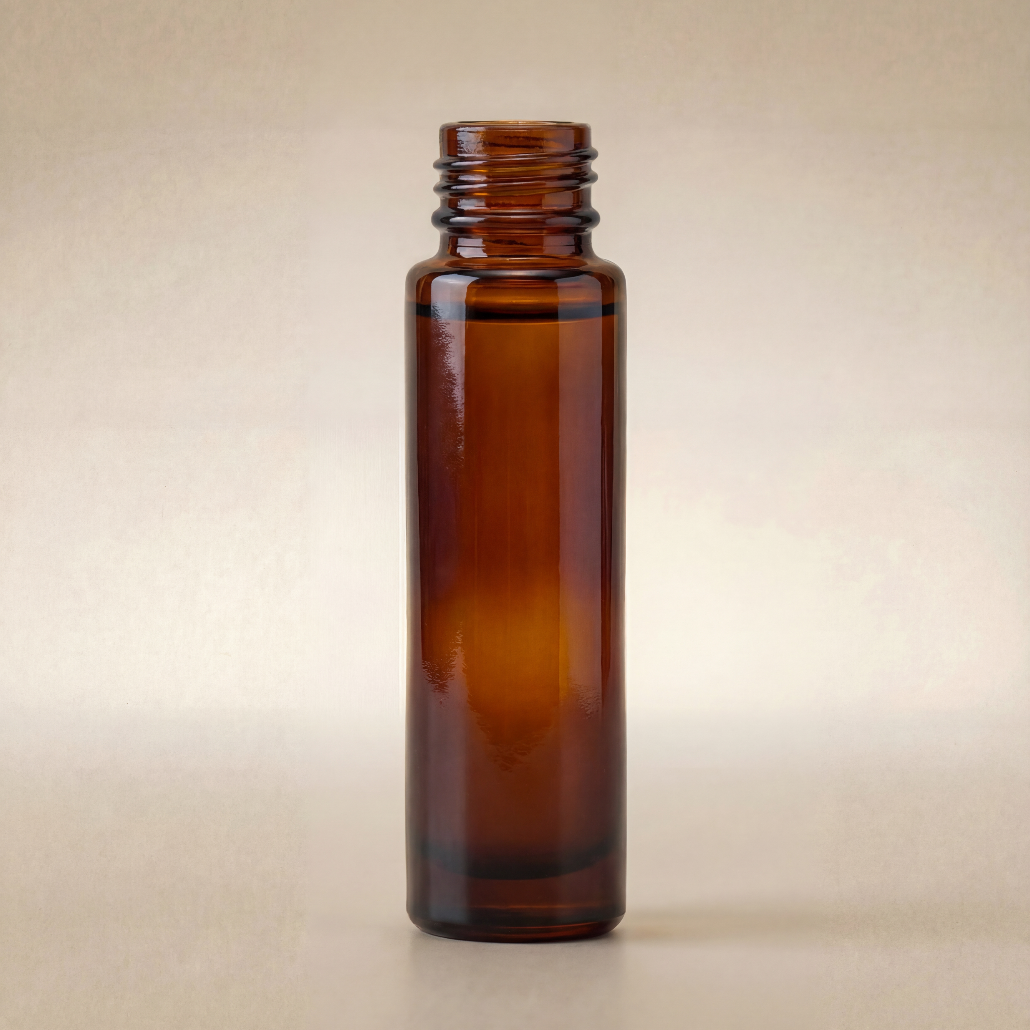 Amber glass bottle on a beige background
