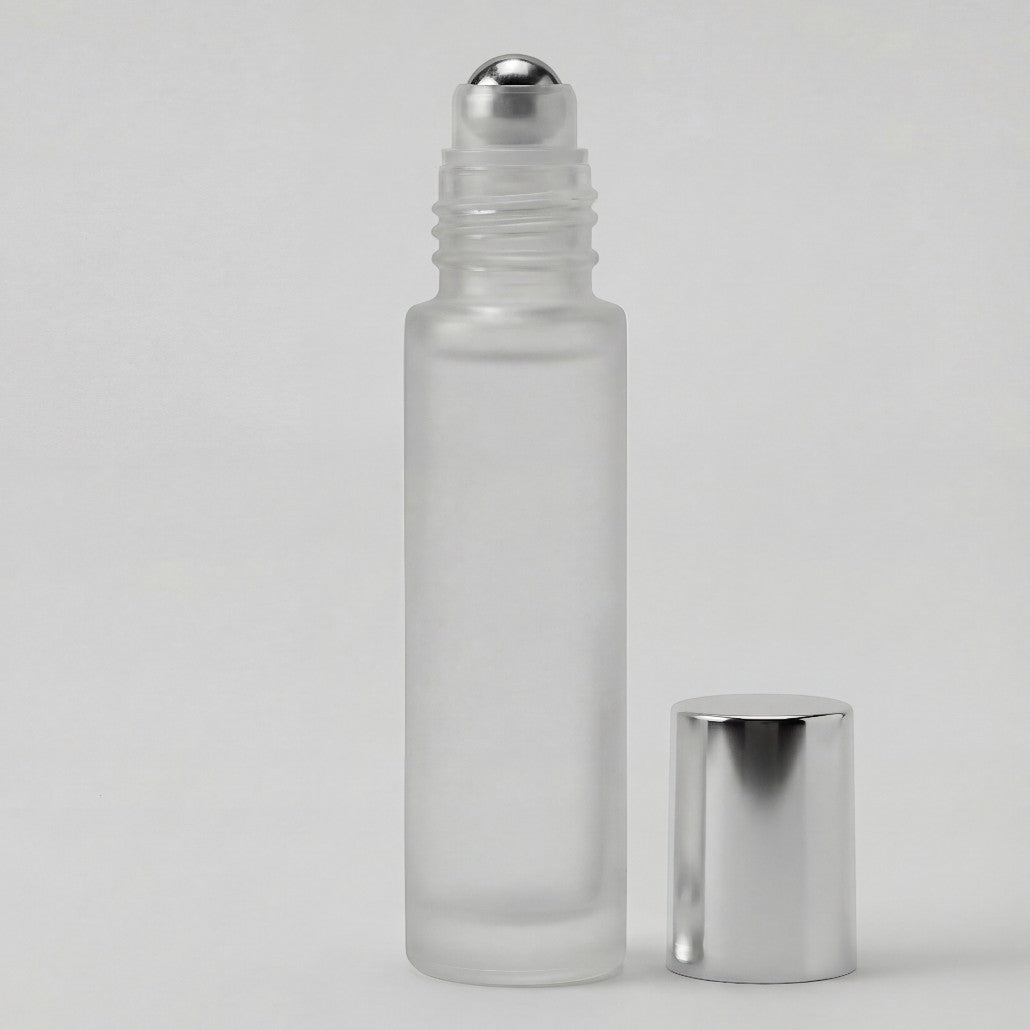 Frosted glass roller bottle with silver cap on a light gray background