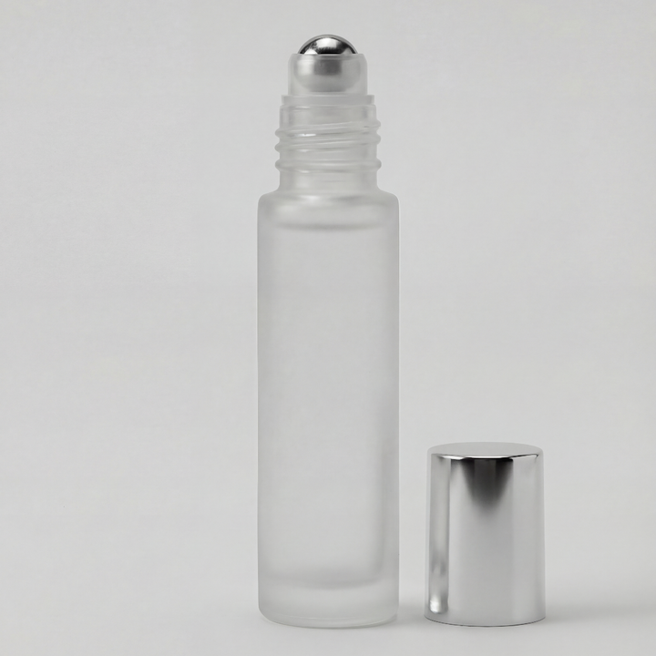 Frosted glass roller bottle with silver cap on a light gray background