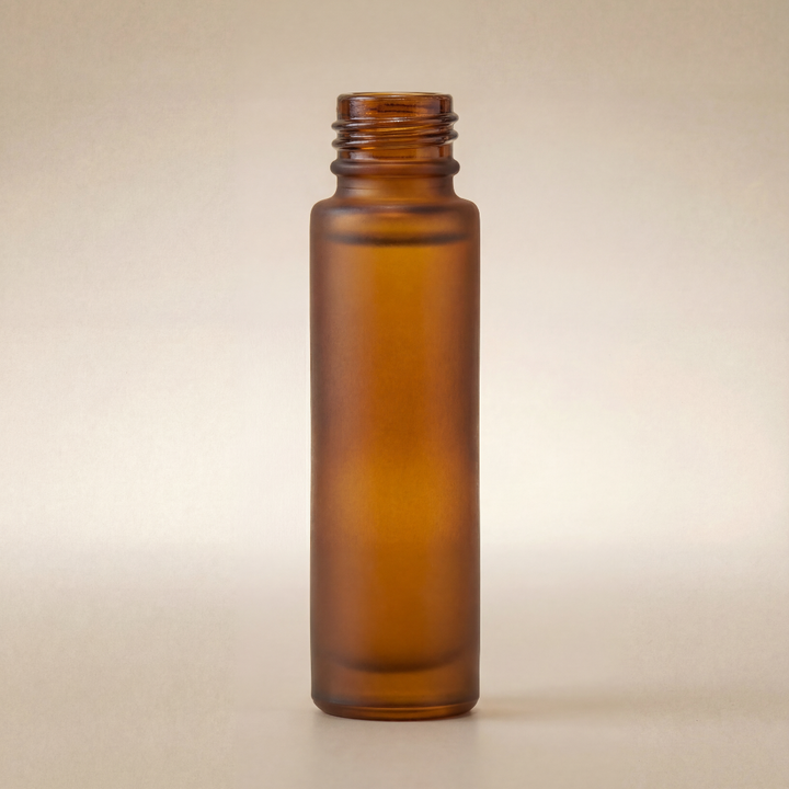 Amber glass bottle on a beige background
