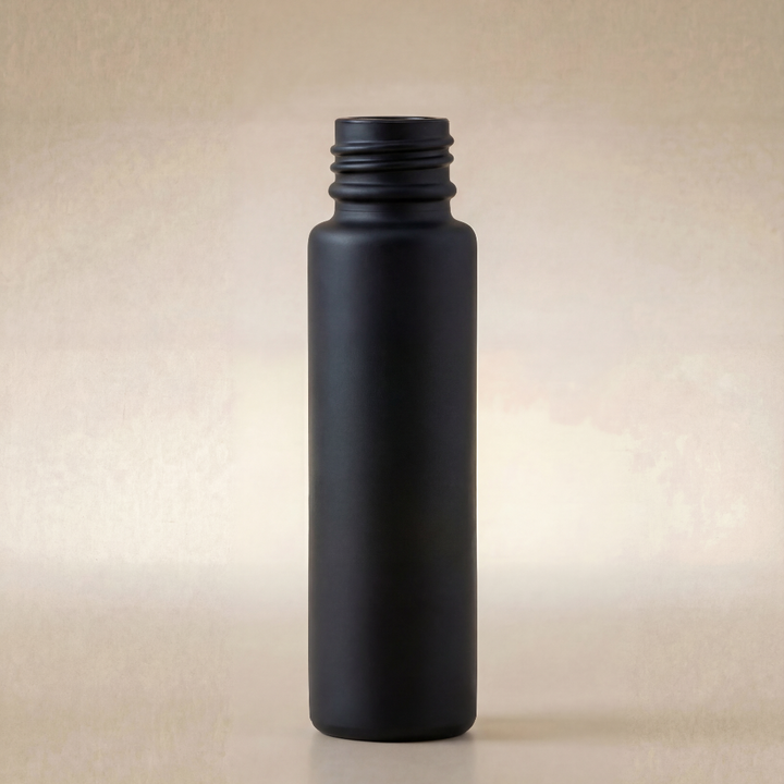 Black bottle on a beige background