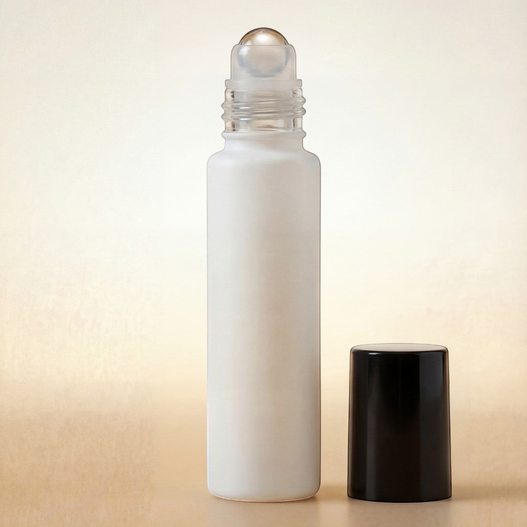 White roller bottle with a black cap on a beige background