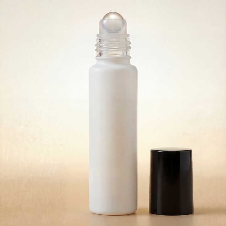 White roller bottle with a black cap on a beige background