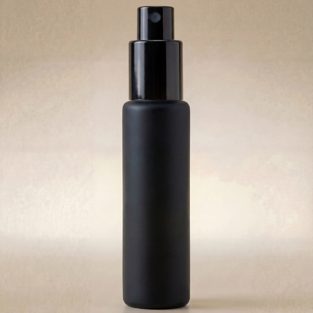 Black spray bottle on a beige background