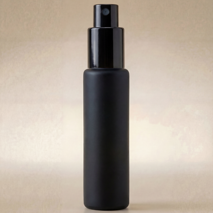 Black spray bottle on a beige background