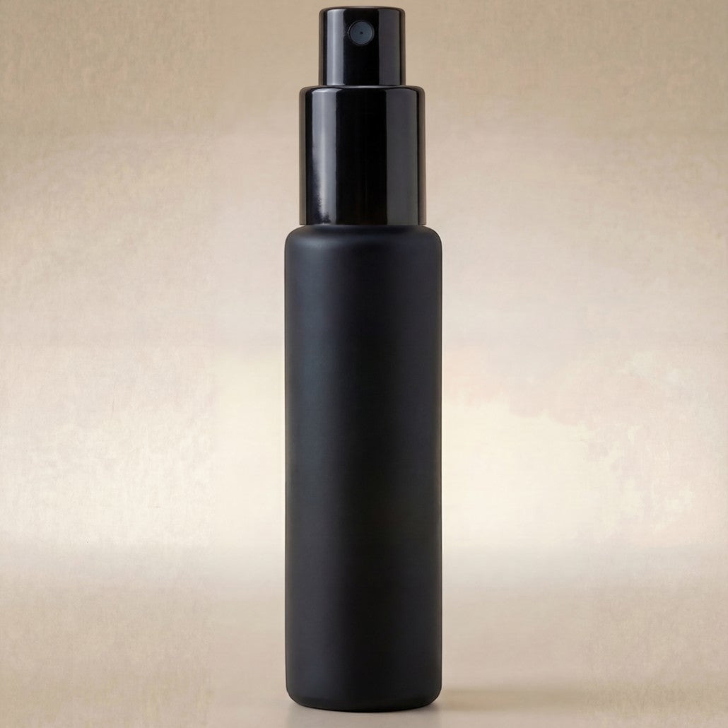 Black spray bottle on a beige background
