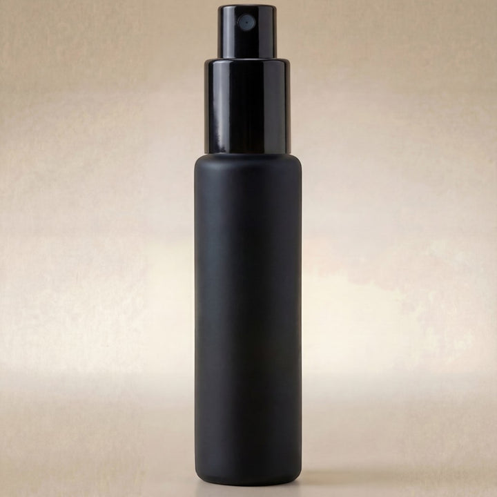 Black spray bottle on a beige background