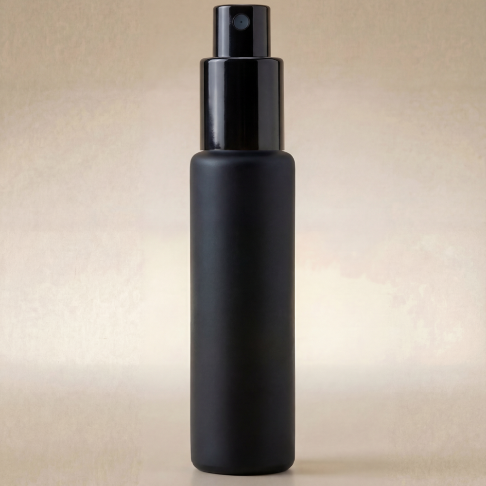 Black spray bottle on a beige background