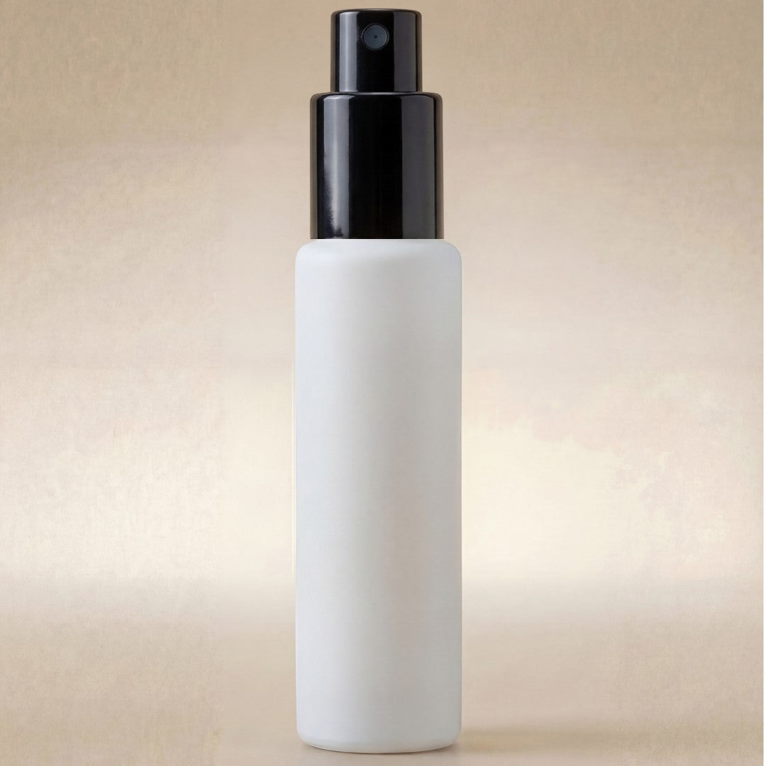 White spray bottle with black nozzle on a beige background