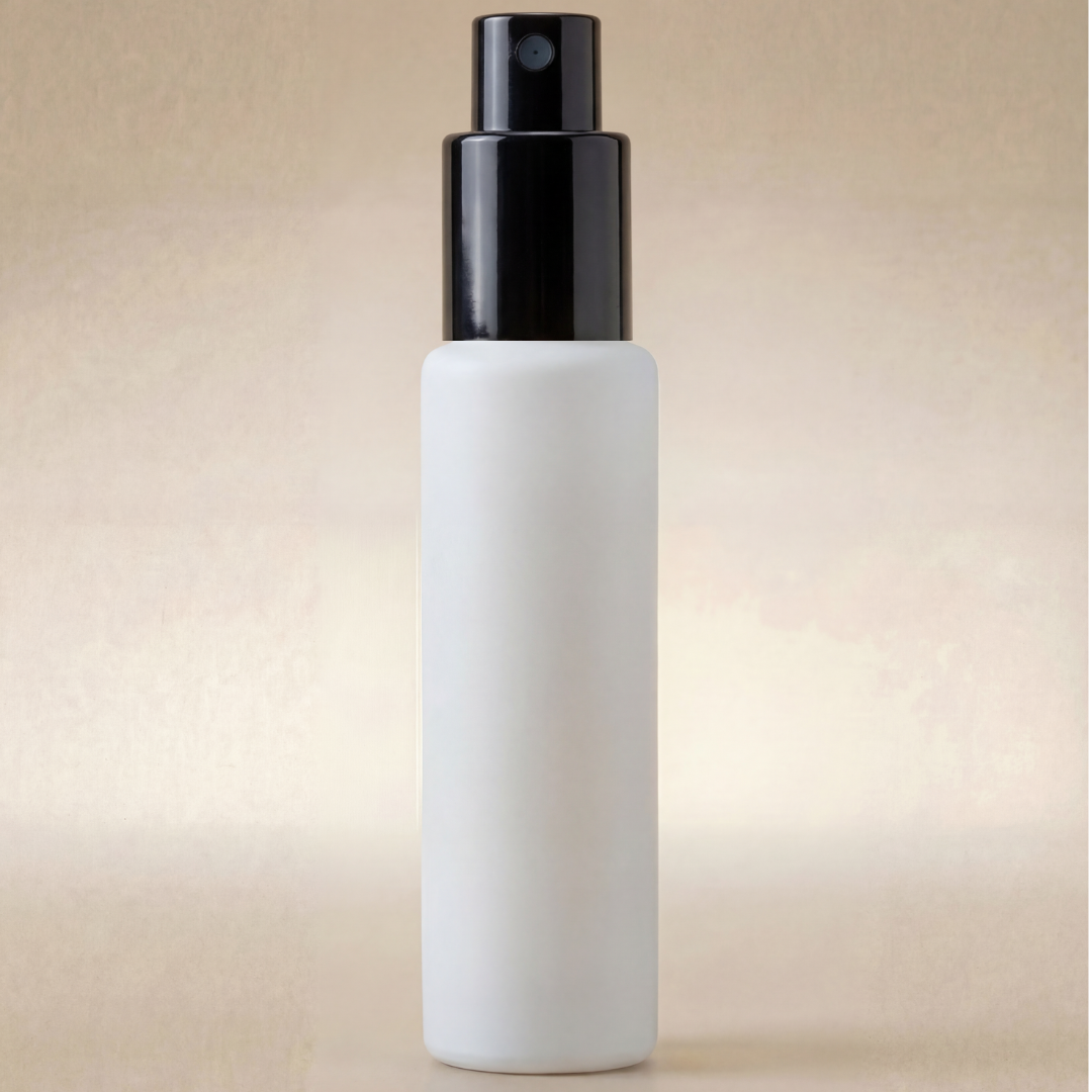 White spray bottle with black nozzle on a beige background
