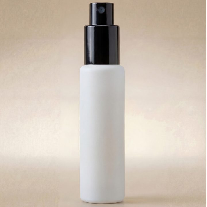 White spray bottle with black nozzle on a beige background