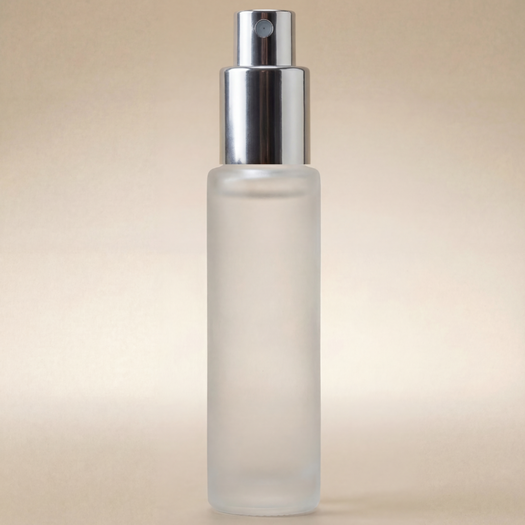 Frosted spray bottle with silver nozzle on a beige background