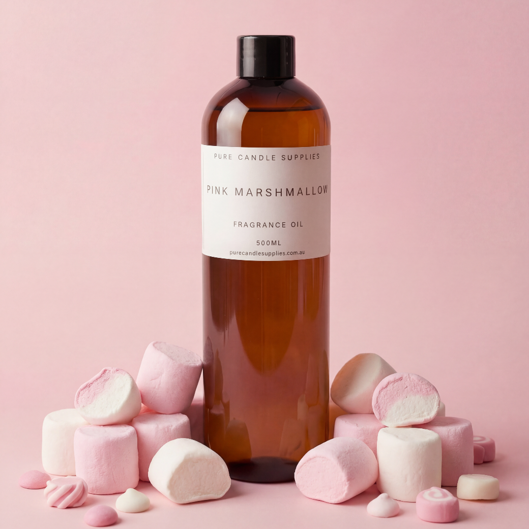 Bottle of Pink Marshmallow fragrance oil with marshmallows on a pink background