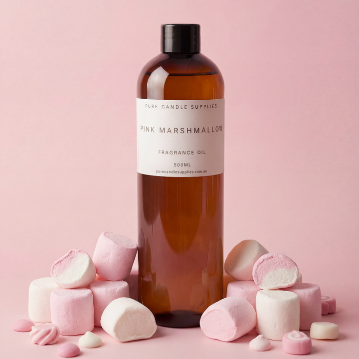 Bottle of Pink Marshmallow fragrance oil with marshmallows on a pink background