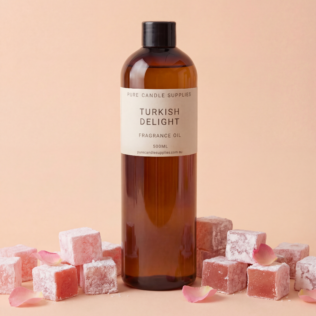 Bottle of 'Turkish Delight' fragrance oil with Turkish delight cubes on a beige background