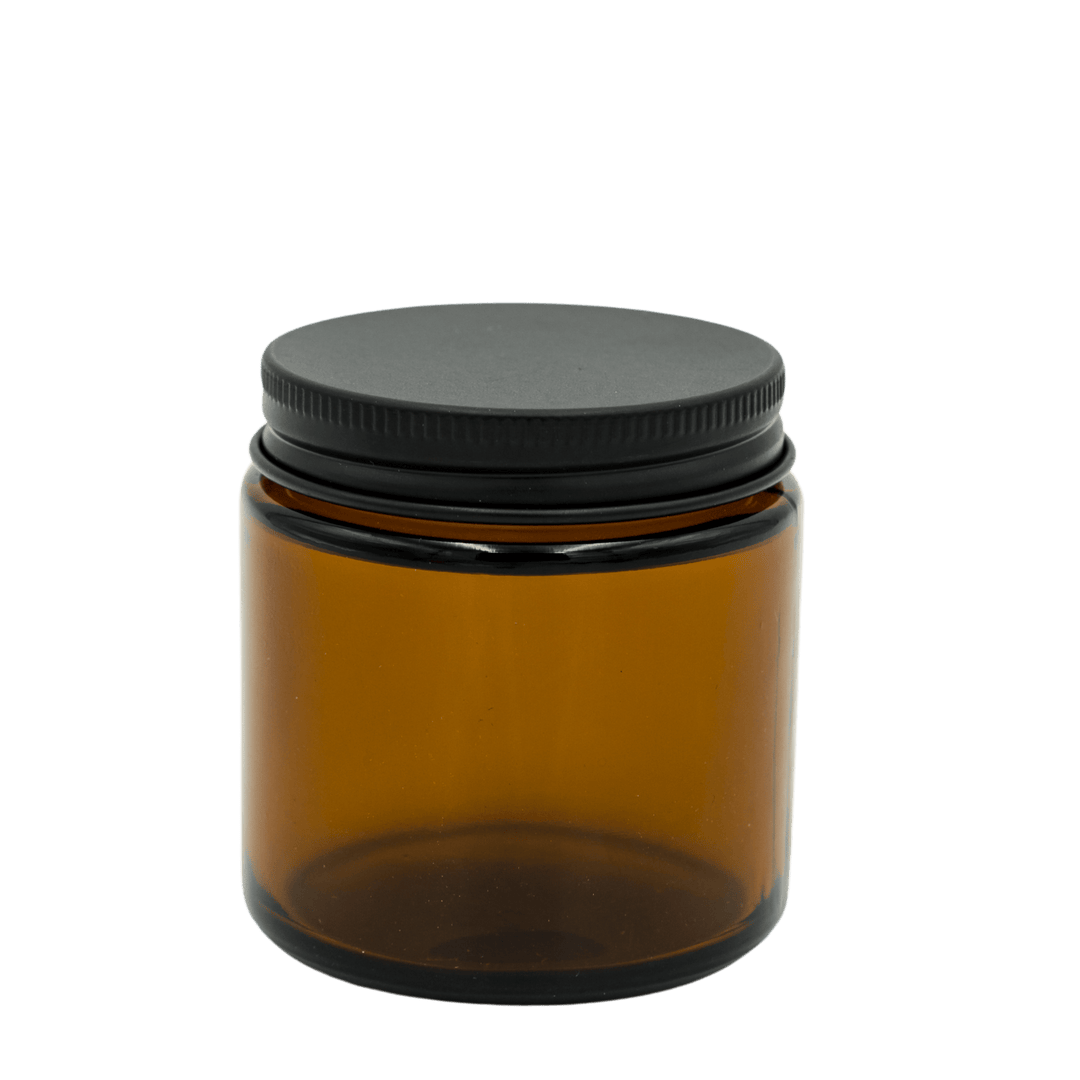 small amber apothecary style candle jar with matte black lid