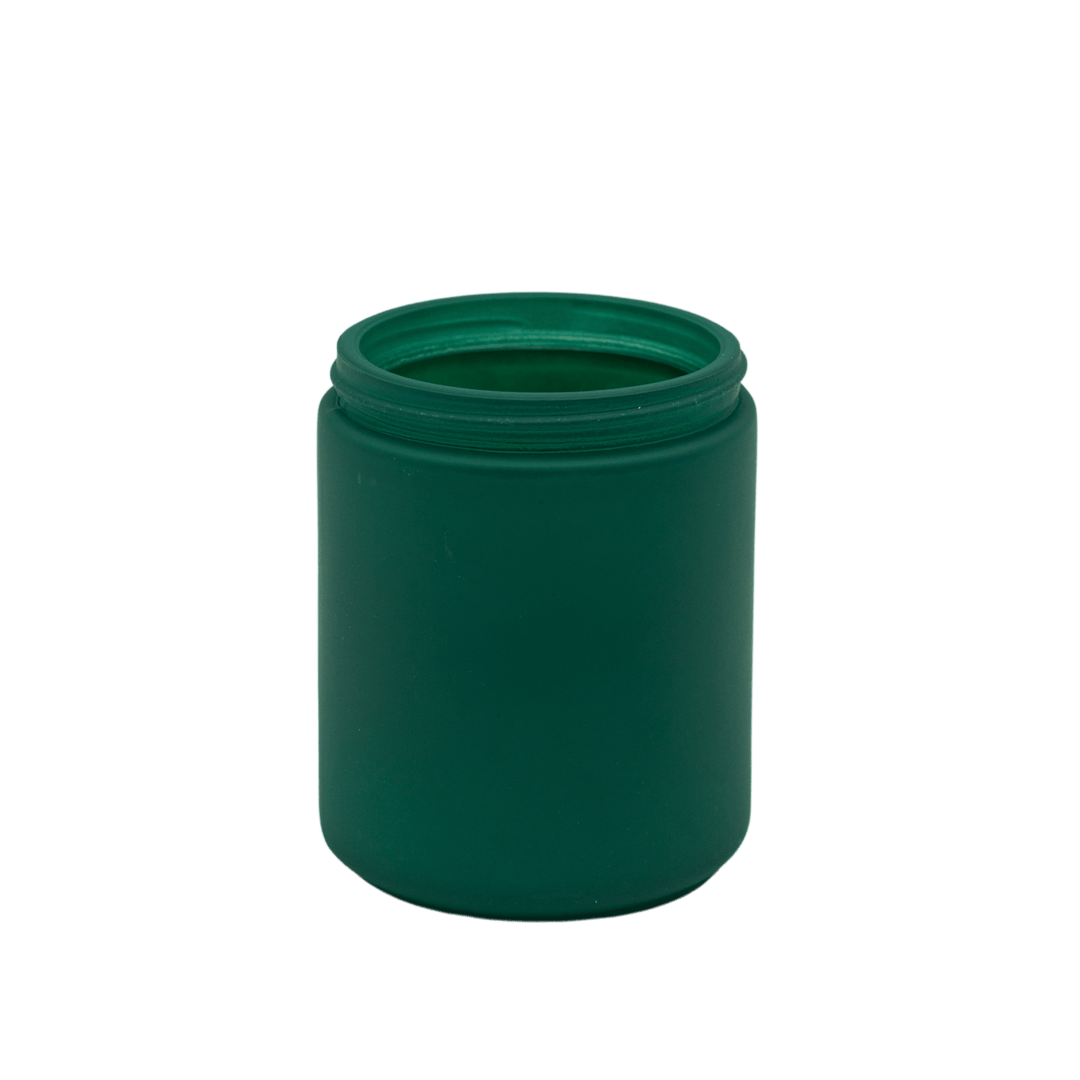 small green apothecary style candle jar