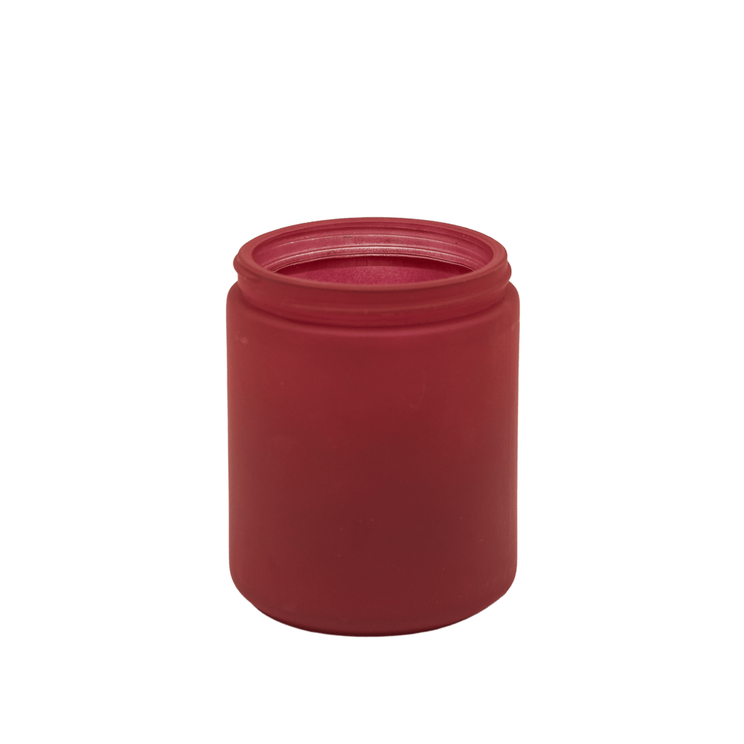small red apothecary style candle jar