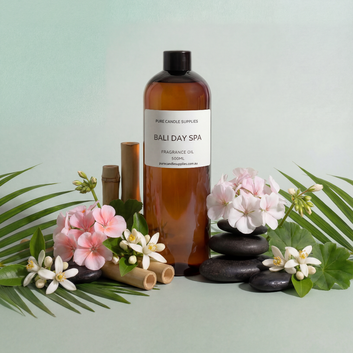 Bottle of Bali Day Spa product with flowers and stones on a light green background