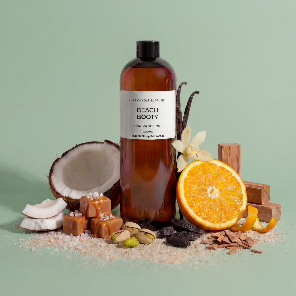 Bottle of 'Beach Booty' fragrance oil with coconut, orange, vanilla, and chocolate elements on a green background