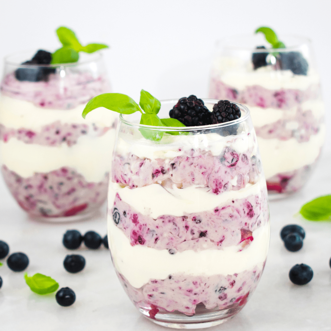 Raspberry & cream layered parfait in glass cup