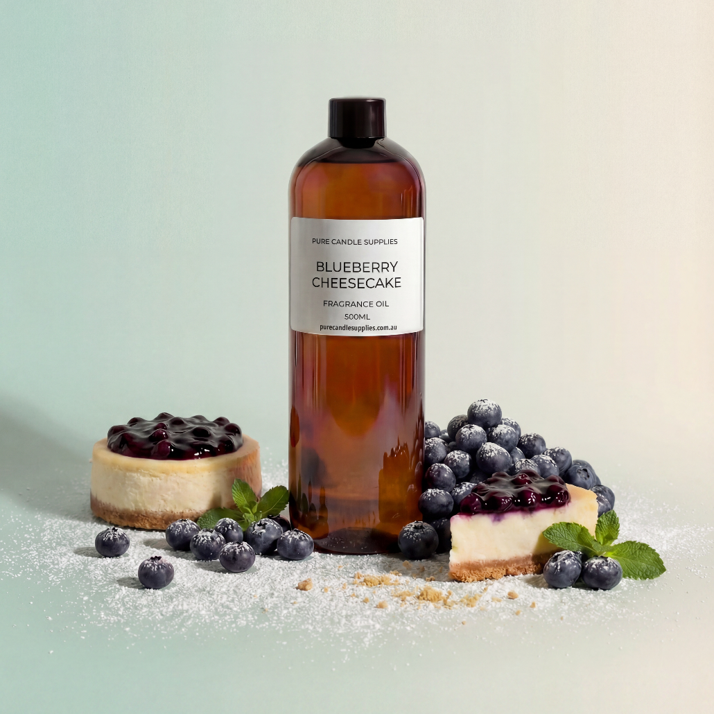 Bottle of Blueberry Cheesecake fragrance oil with blueberries and cheesecake on a light background
