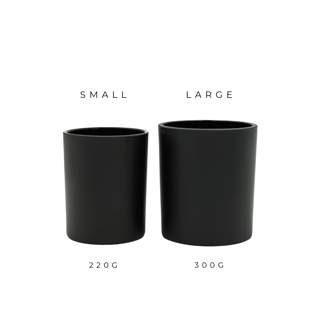 two black bobby oxford type glassware candle jars in small and large next to each other