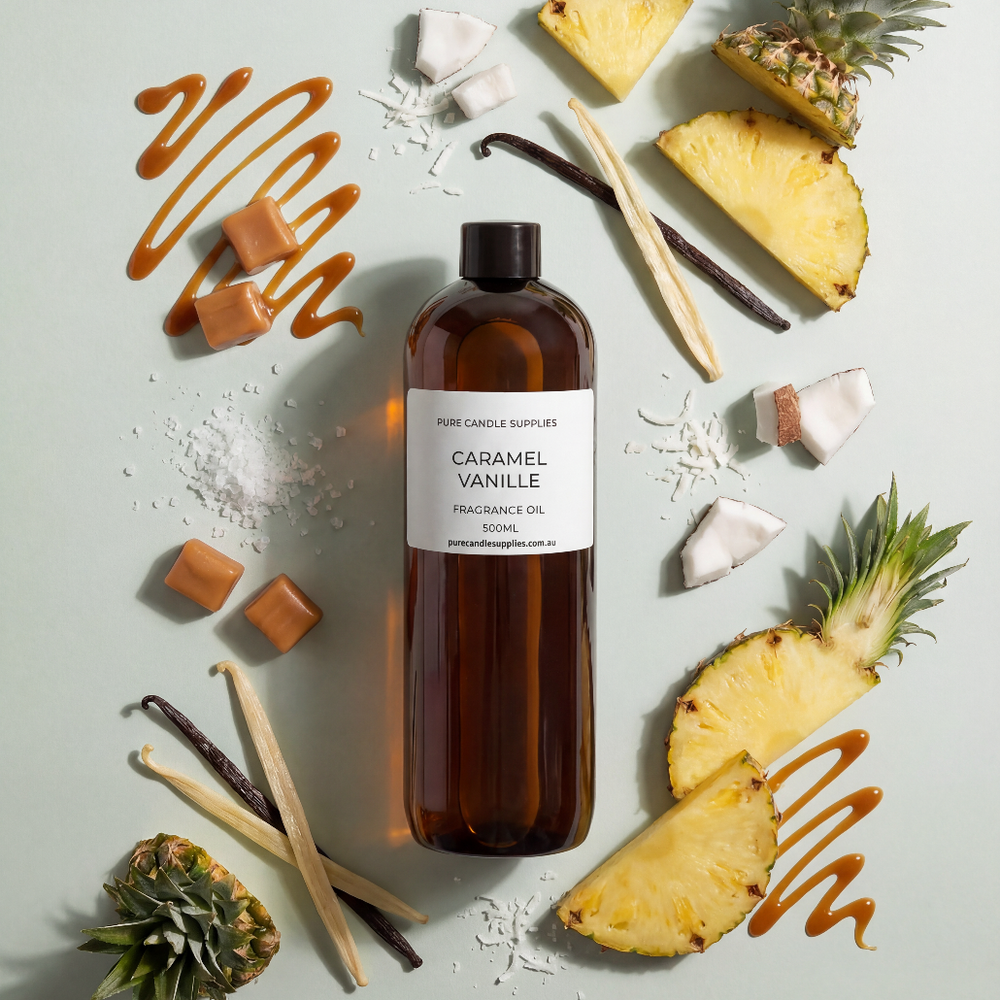 Brown bottle labeled 'Caramel Vanille' surrounded by pineapple slices and vanilla beans on a light gray background