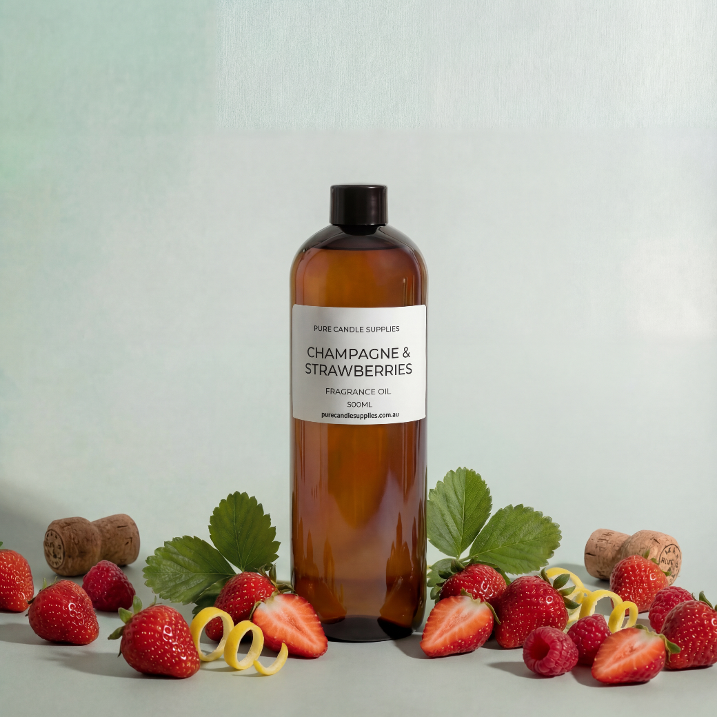 Bottle of 'Champagne & Strawberries' fragrance oil with strawberries and leaves on a light background