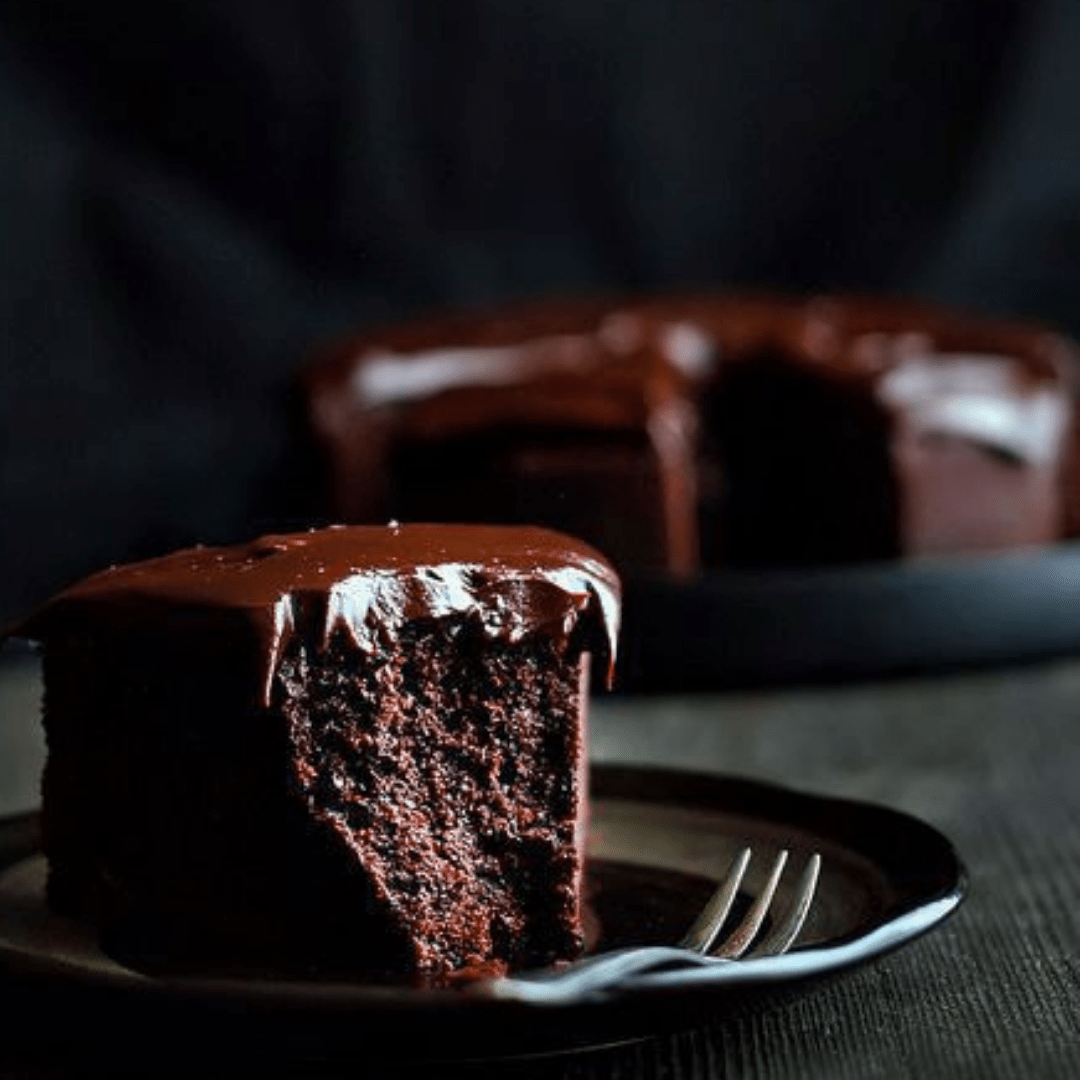 piece of chocolate mudcake with bite taken away