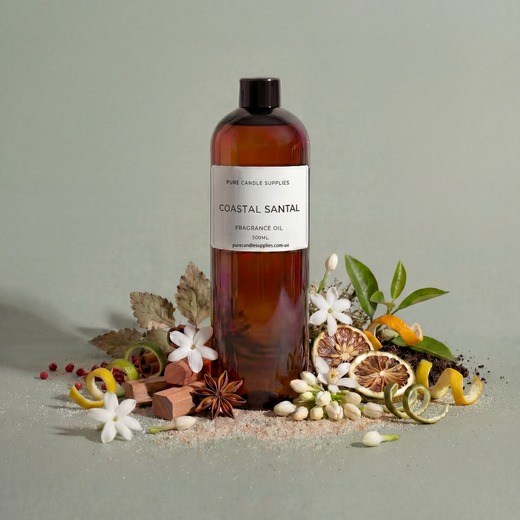 Bottle of Coastal Santal fragrance oil with decorative elements on a neutral background