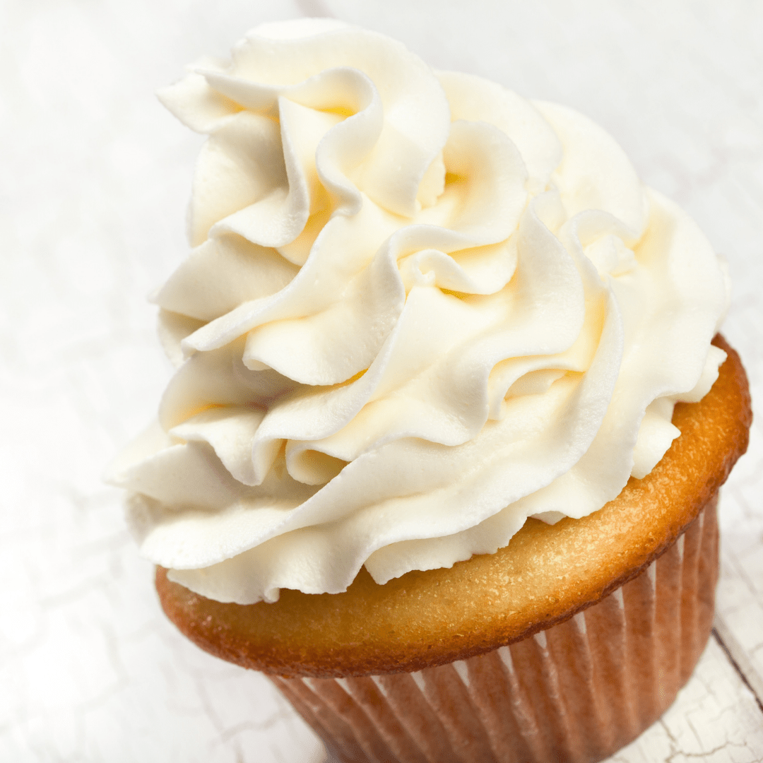vanilla cupcake with vanilla frosting piped ontp base