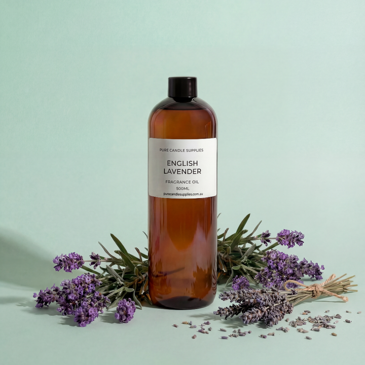 Bottle of English Lavender oil with lavender flowers on a light green background