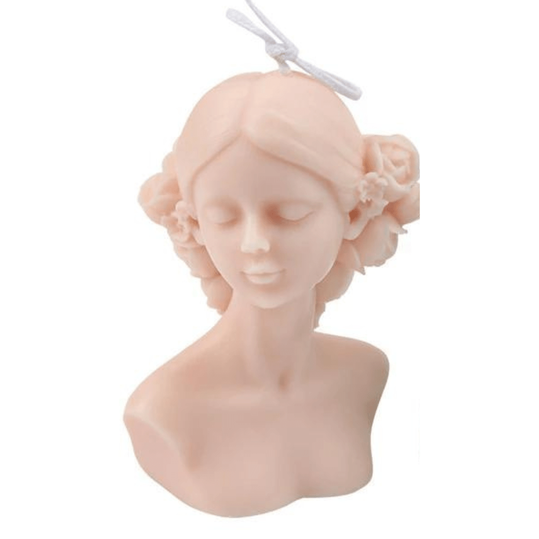 female torso candle with floral crown in pink wax on white background