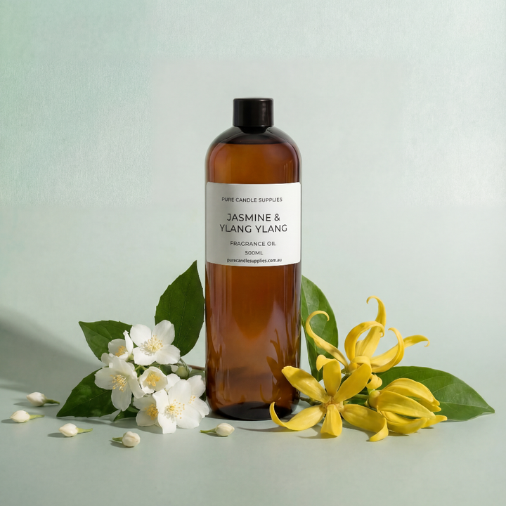 Bottle of Jasmine & Ylang Ylang oil with flowers on a light green background