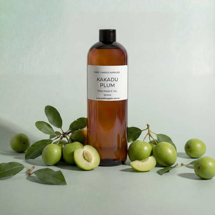 Bottle of Kakadu Plum oil with fruits and leaves on a light green background