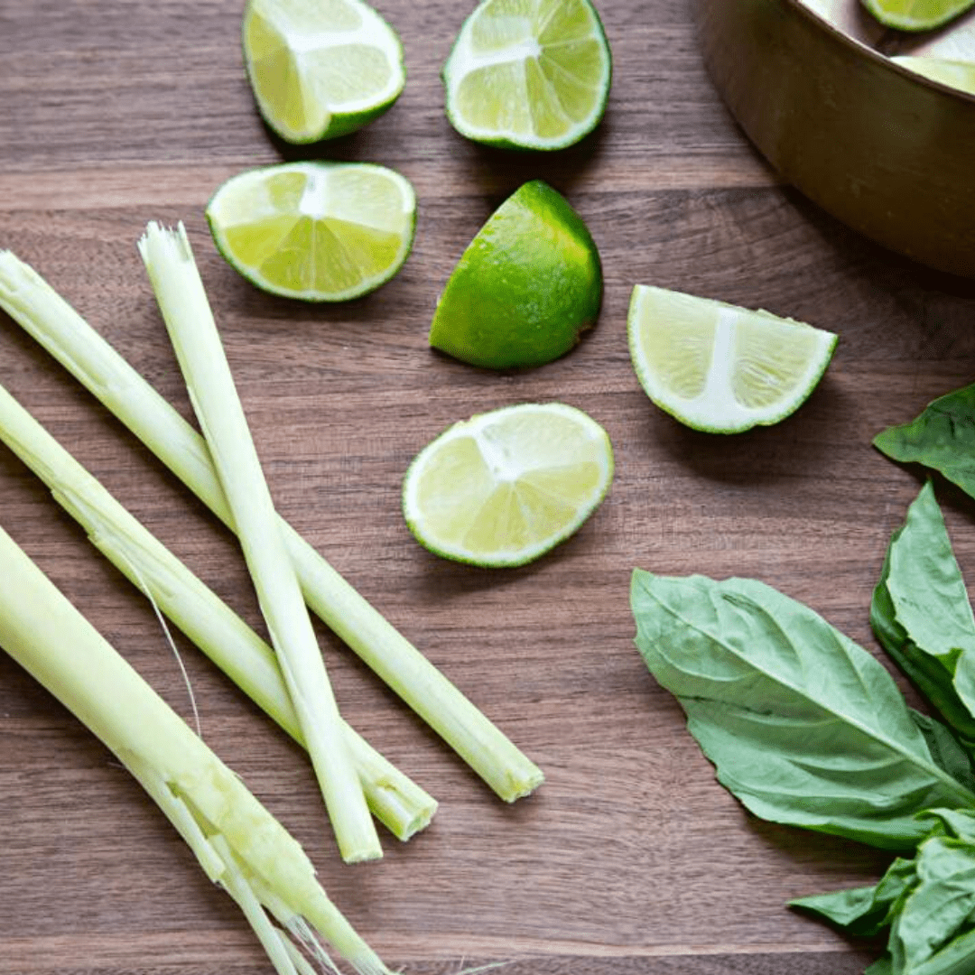 Stems of lemongrass and fresh cut limes