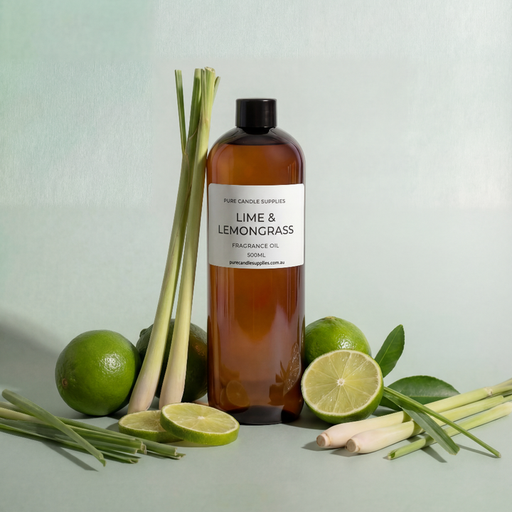 Bottle of Lime & Lemongrass fragrance oil with fresh lime and lemongrass on a light green background